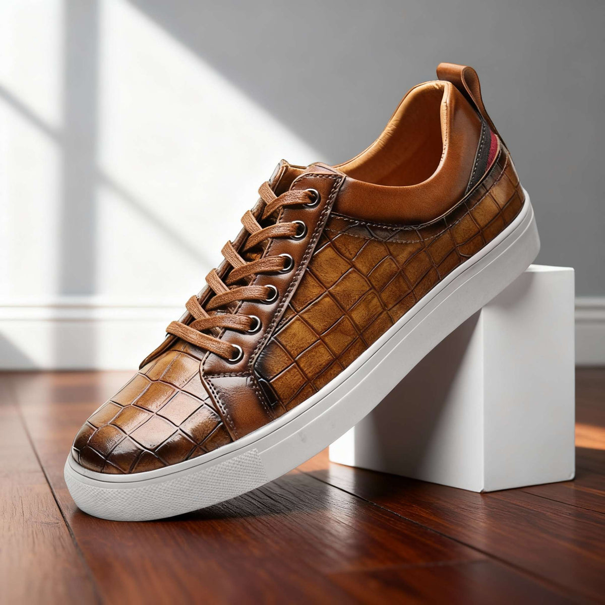 Men's leather sneakers by Charles Ray on dark hardwood floor, casual men's footwear by Hudson Ridge with stylish leather design.