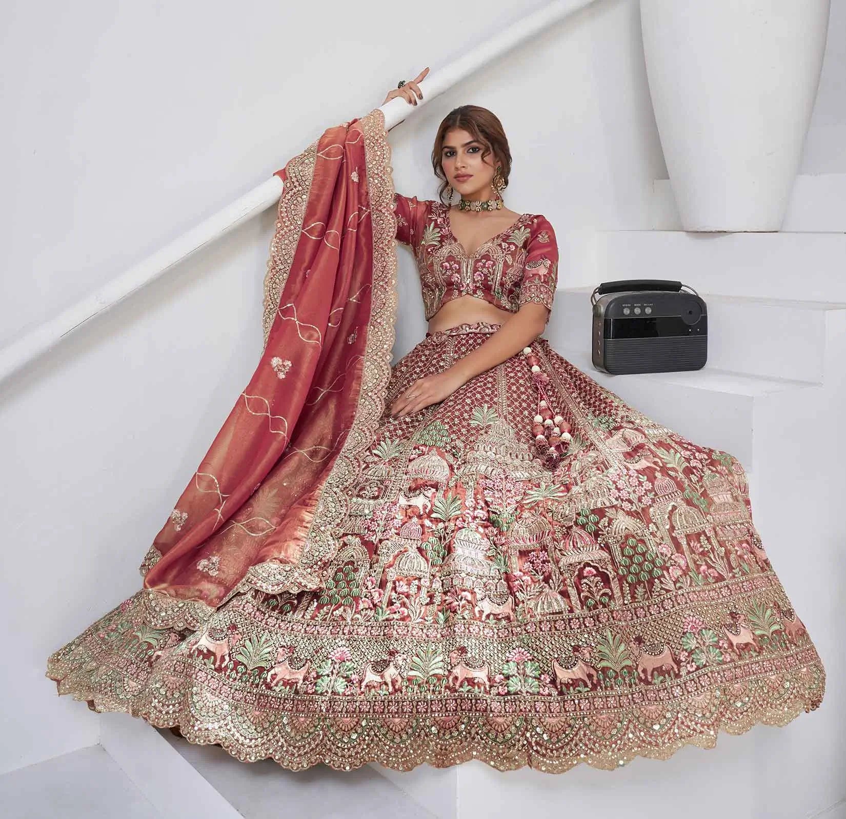 Pinkish Red Bridal Lehenga With Temple & Cow Motifs - qivii