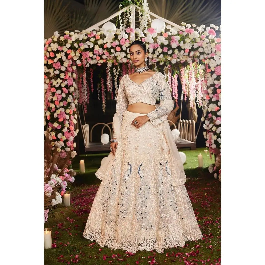 Light Peach Soft Net Lehenga With Multi Thread Sandwich Sequins Embroidery Work