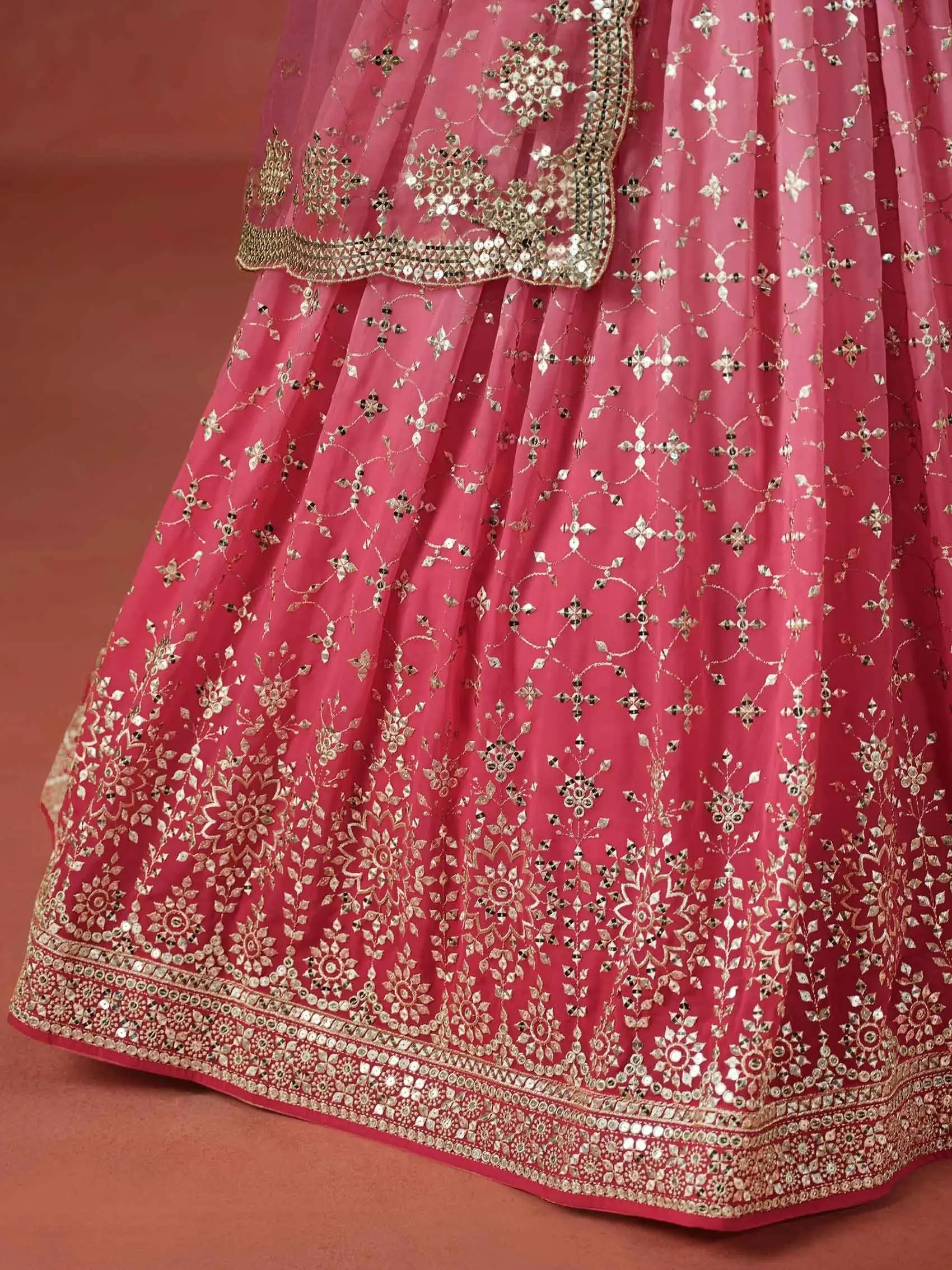 Pink lehenga with gold floral embroidery and mirror work details