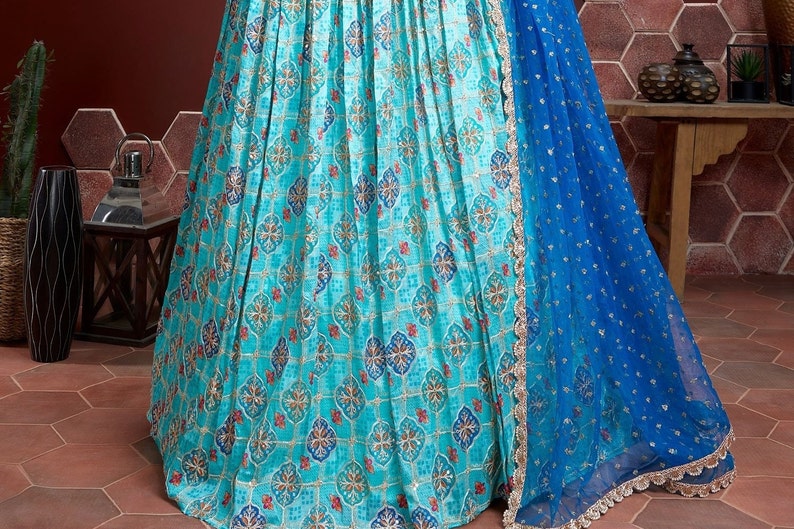 Unstitched chinon silk choli with real mirror work and embroidered net dupatta