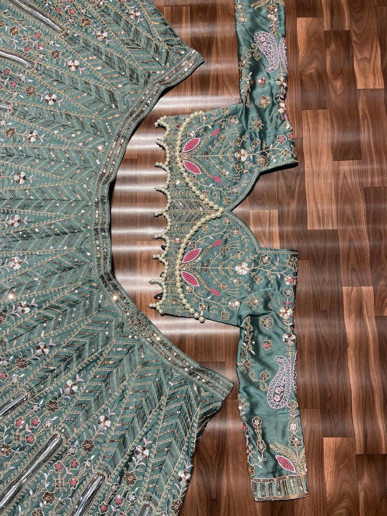 Beautiful red and gold designer lehenga choli with intricate embroidery and traditional motifs for weddings and special occasions