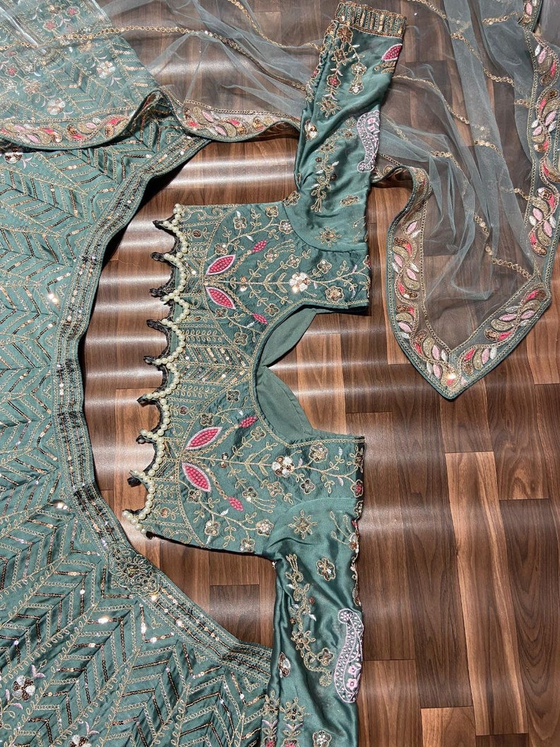 Exquisite red and gold designer lehenga choli with intricate embroidery work