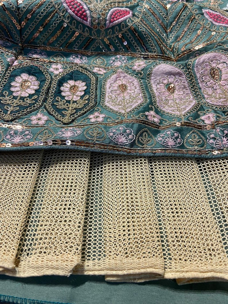 Beautiful red and gold designer lehenga choli with intricate embroidery details