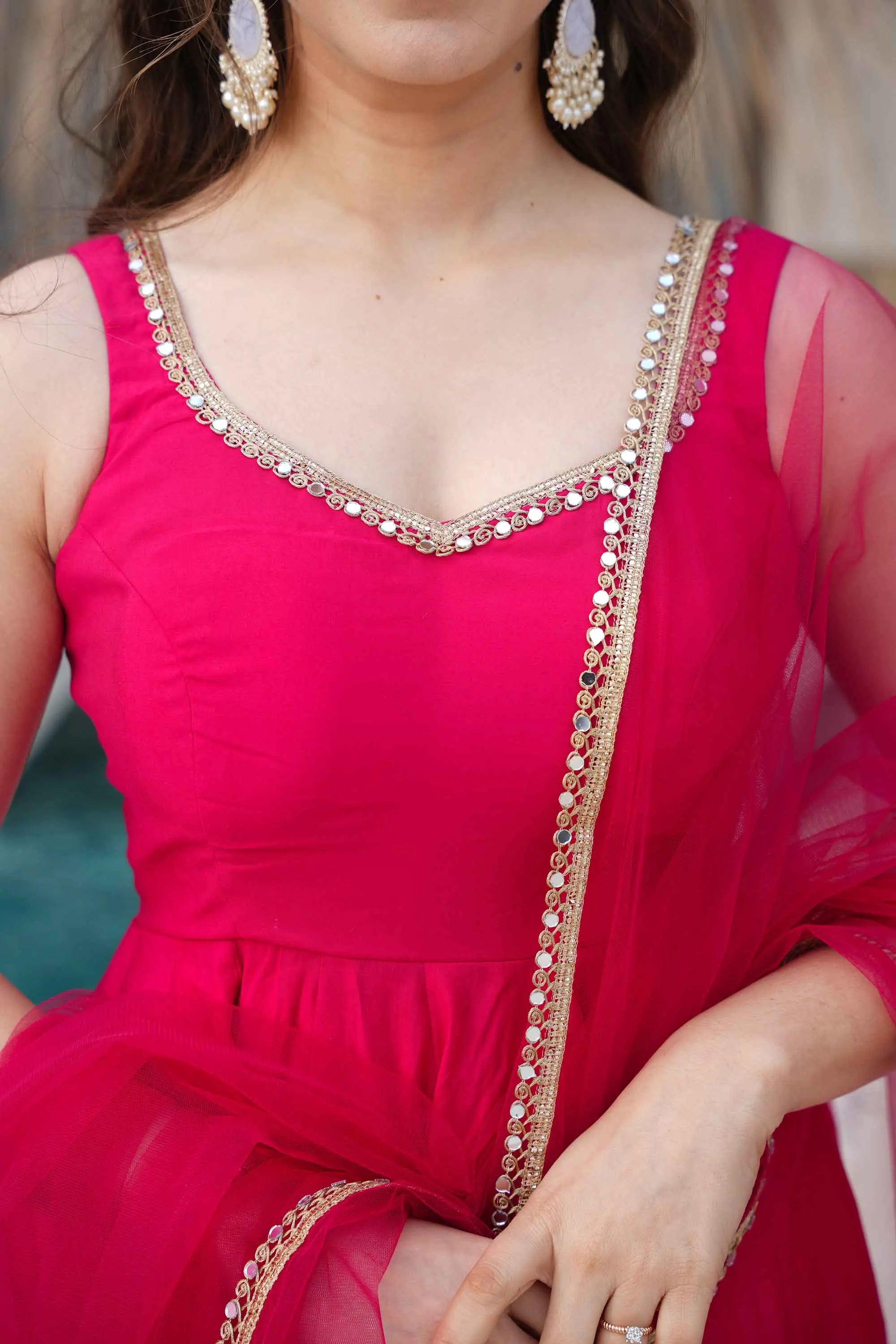 Rani Pink Roman Silk Plain Gown With Mirror Work And Net Dupatta
