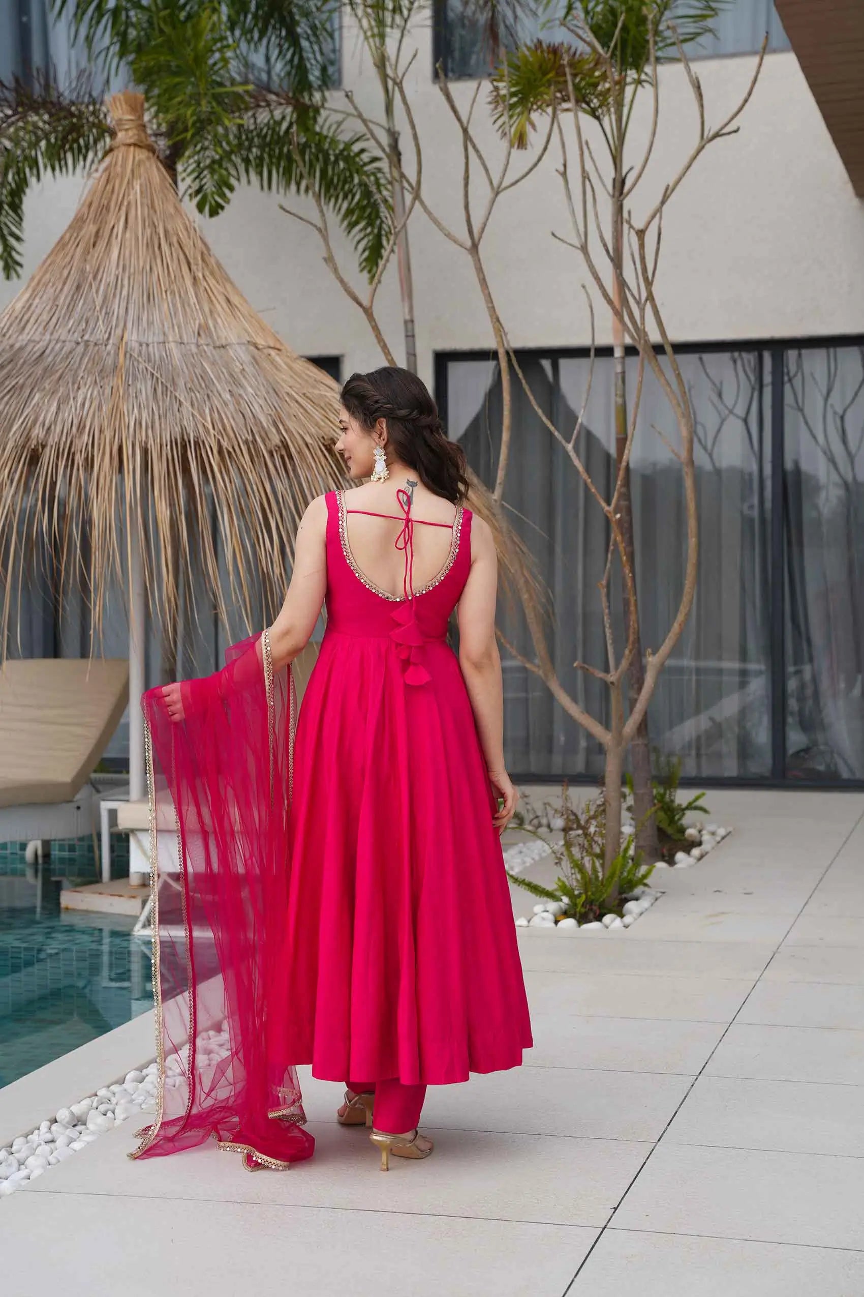 Rani Pink Roman Silk Plain Gown With Mirror Work And Net Dupatta - qivii