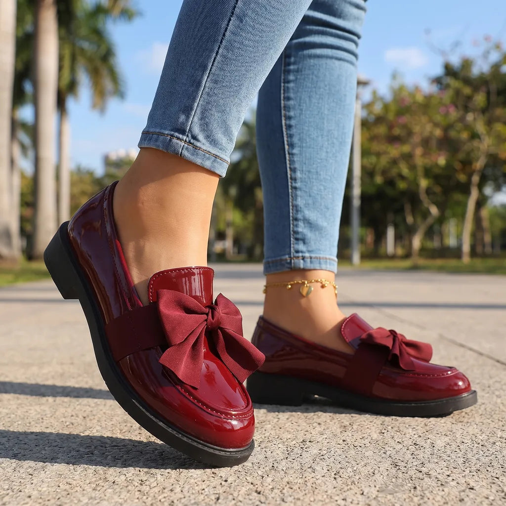 Red women's bow loafers by Hudson Ridge featuring classic slip-on design and stylish bow detail for comfortable everyday wear.