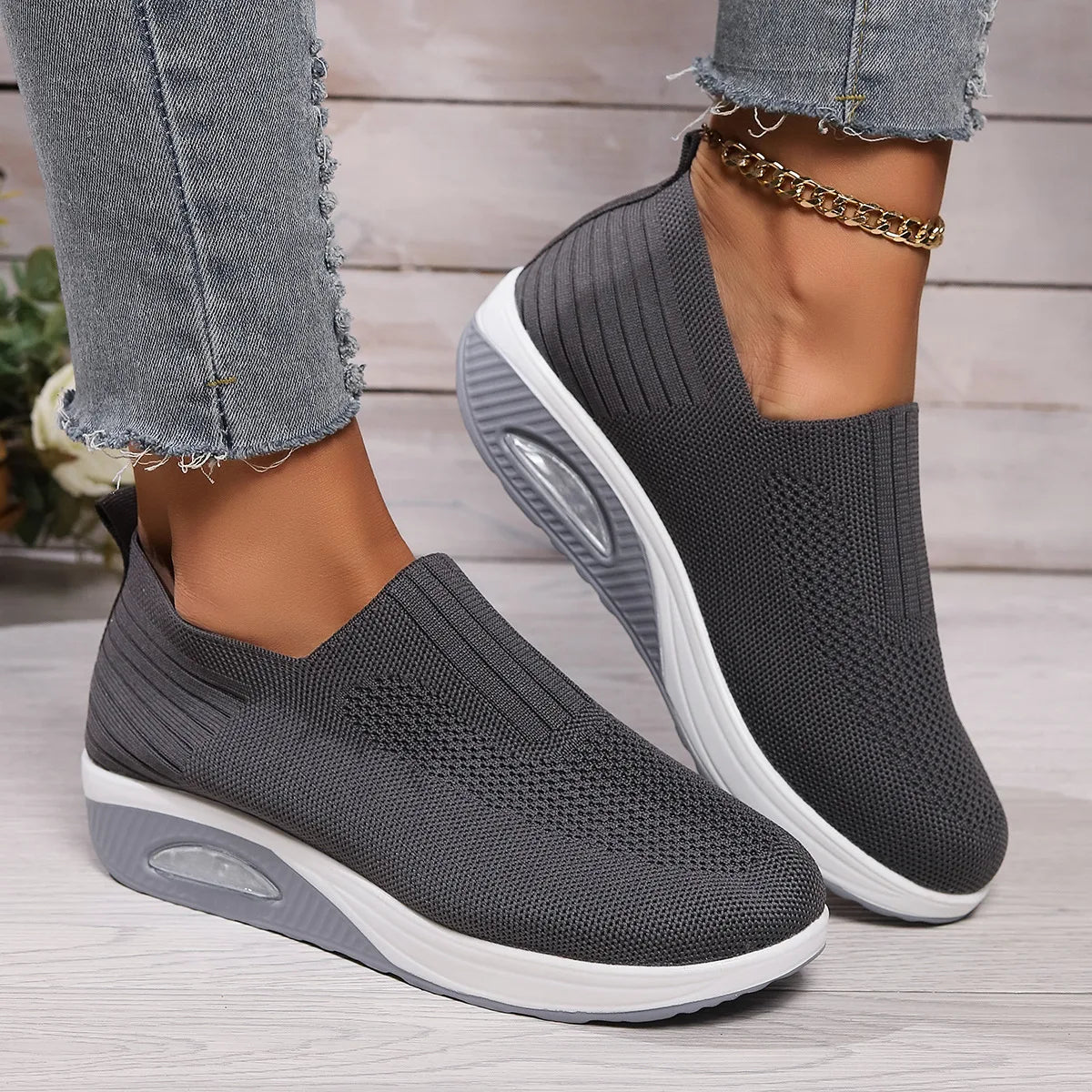 Gray women's orthopedic sneakers from Qivii, cushioned for comfort, by Hudson Ridge, designed for supportive footwear.