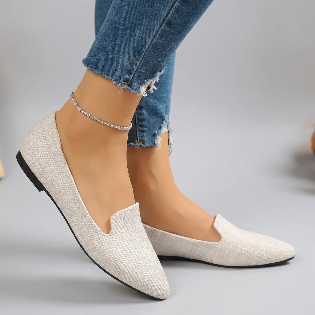Beige Marlena women's ballet flats by Qivii, slip-on style with a smooth, rounded toe and comfortable flat sole.