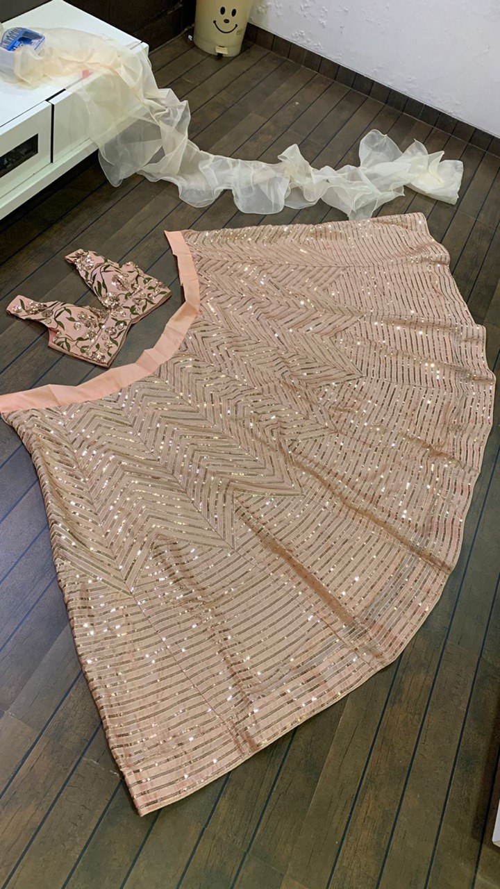 Luxurious Lite Pink Kasturi silk lehnga with intricate zari and sequence work design