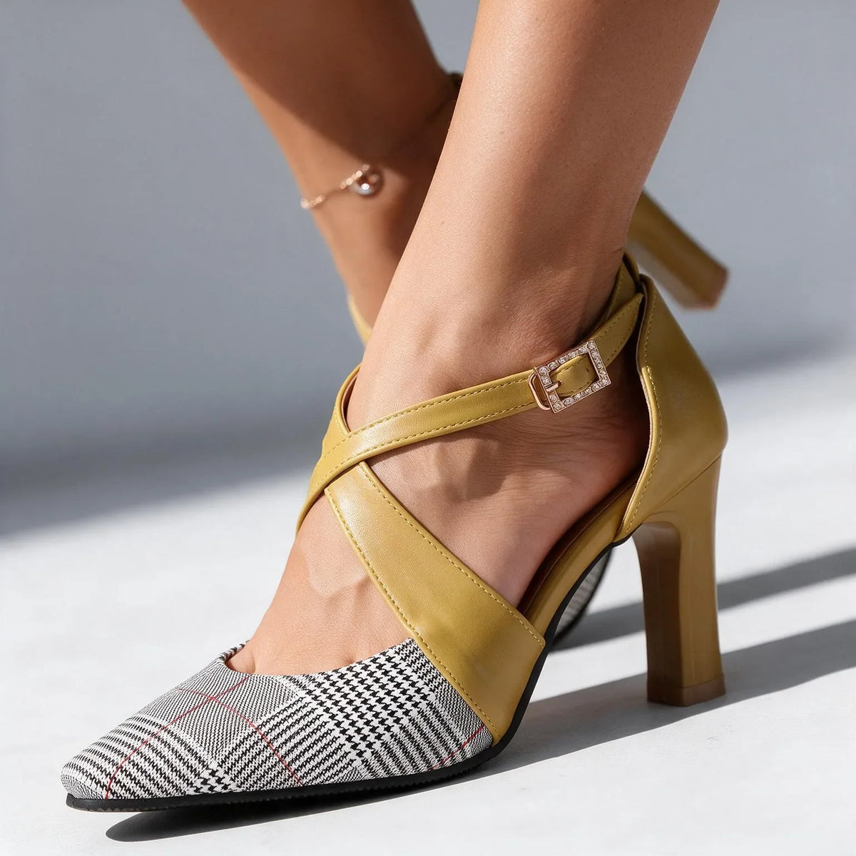 Scarlett Houndstooth Heels by Qivii, women's footwear with stylish multi-colored houndstooth pattern and pointed toe design.