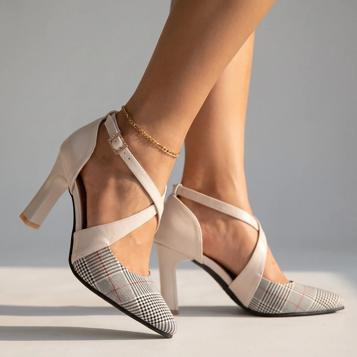 Scarlett Houndstooth Heels by Qivii, stylish women's footwear with a bold houndstooth pattern and pointed toe design.