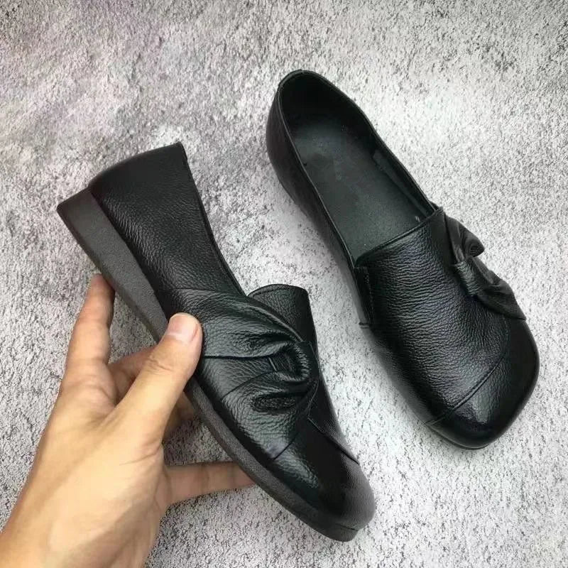 Black Willow women's orthopedic wedge flats by Qivii, featuring comfortable slip-on design and supportive footwear for women.