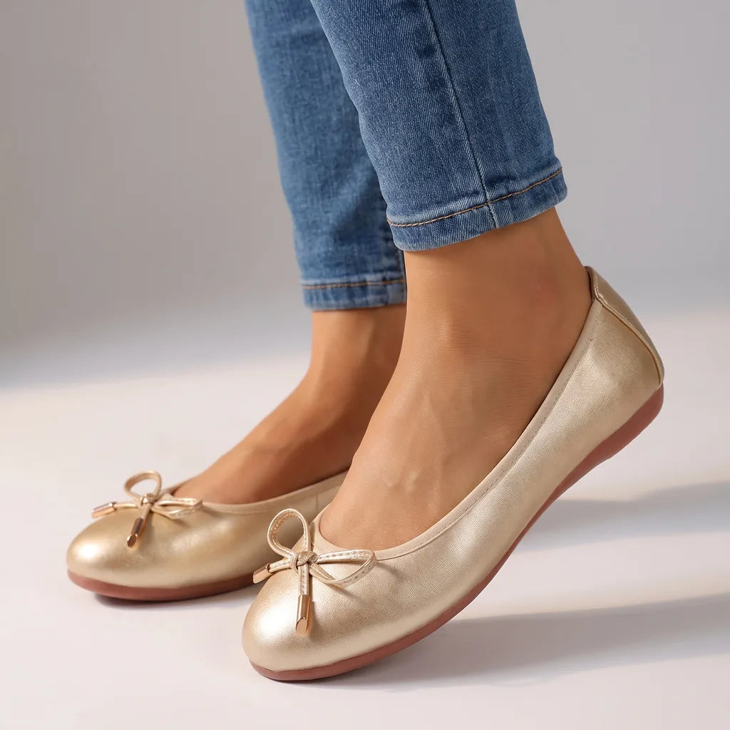 Gold women's ballet flats by Qivii, Hudson Ridge, featuring a sleek design and comfortable slip-on style for women's footwear.
