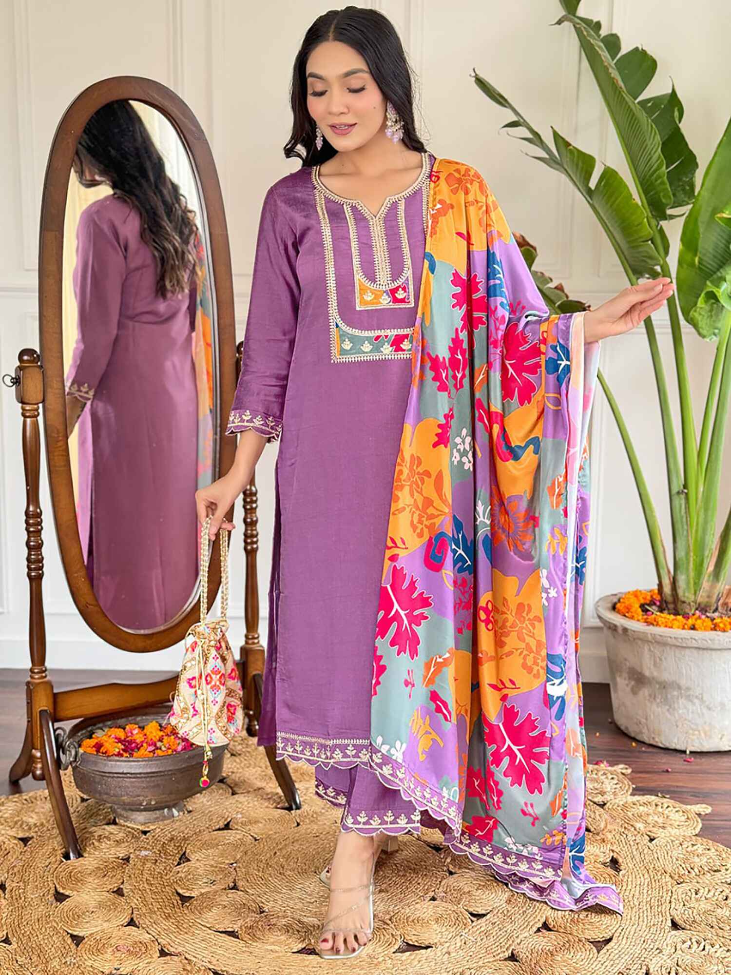 Beautiful shocking purple viscose suit with intricate thread embroidery and sequin detailing