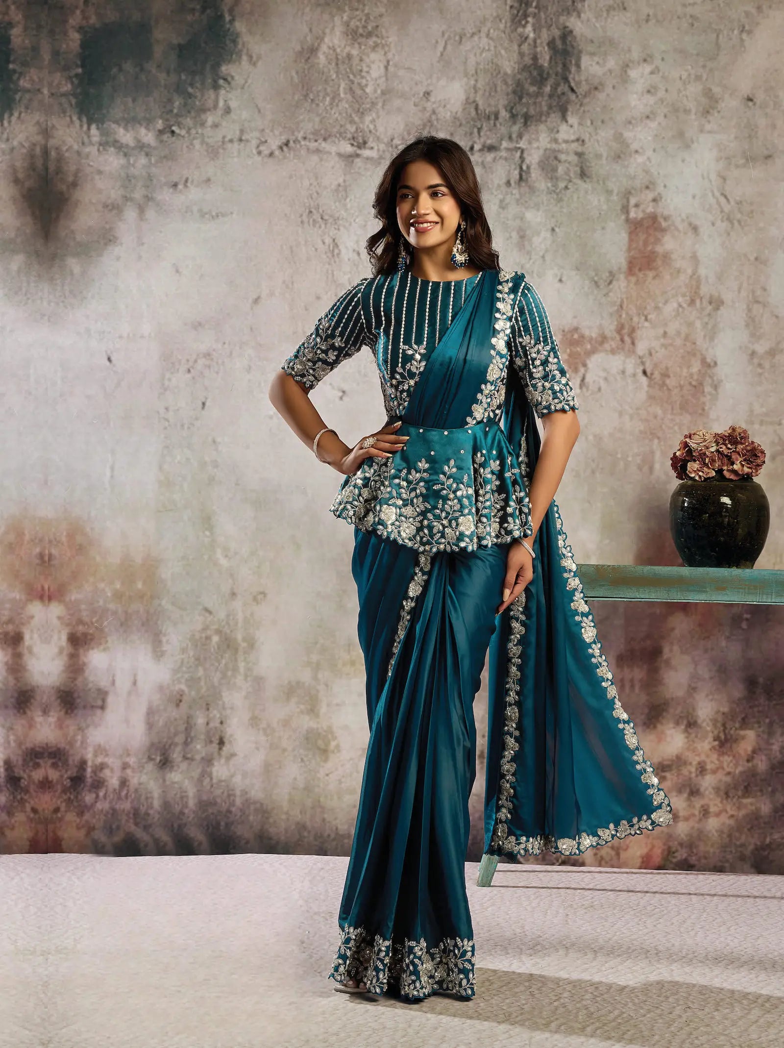 Deep teal ready-to-wear satin saree with sequin embroidery and peplum-style blouse