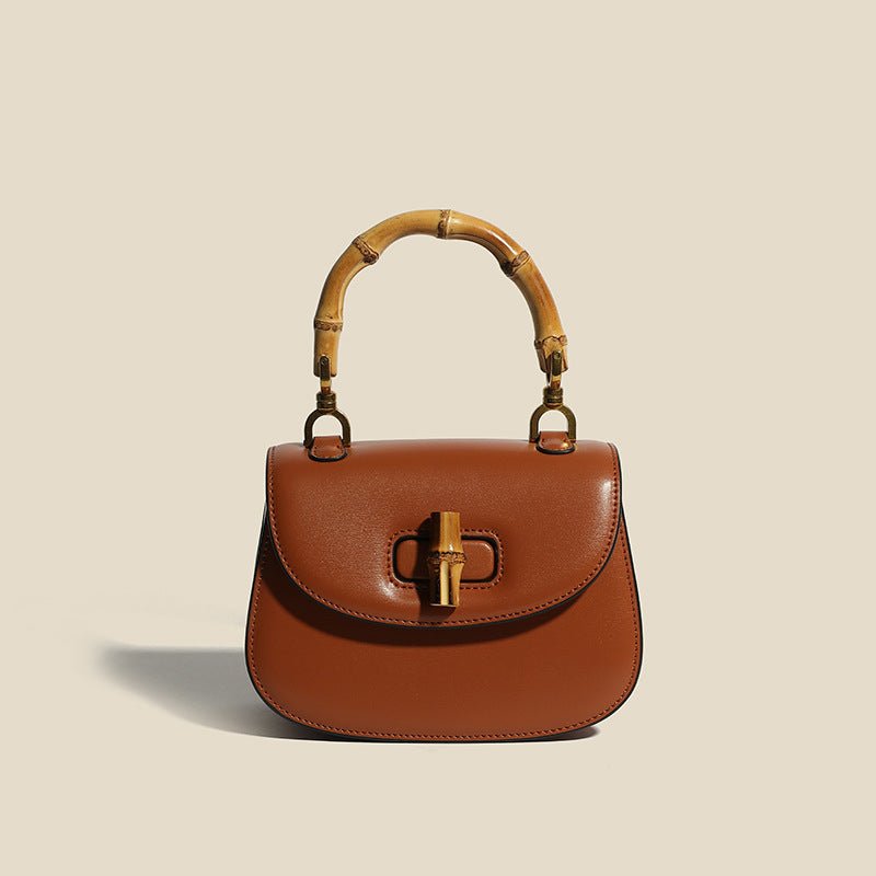 Structured brown top-handle handbag illustrating an everyday handbag size guide