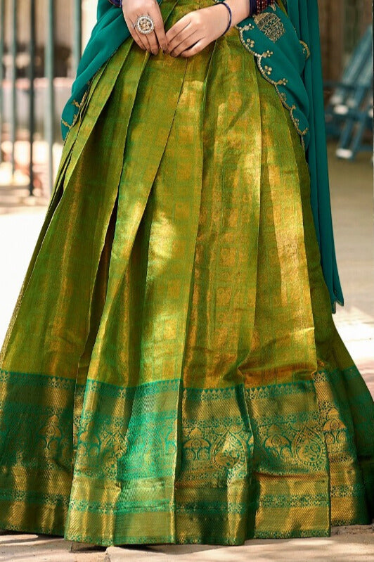 Kanjivaram silk in this regal lehenga choli in Parrot Color