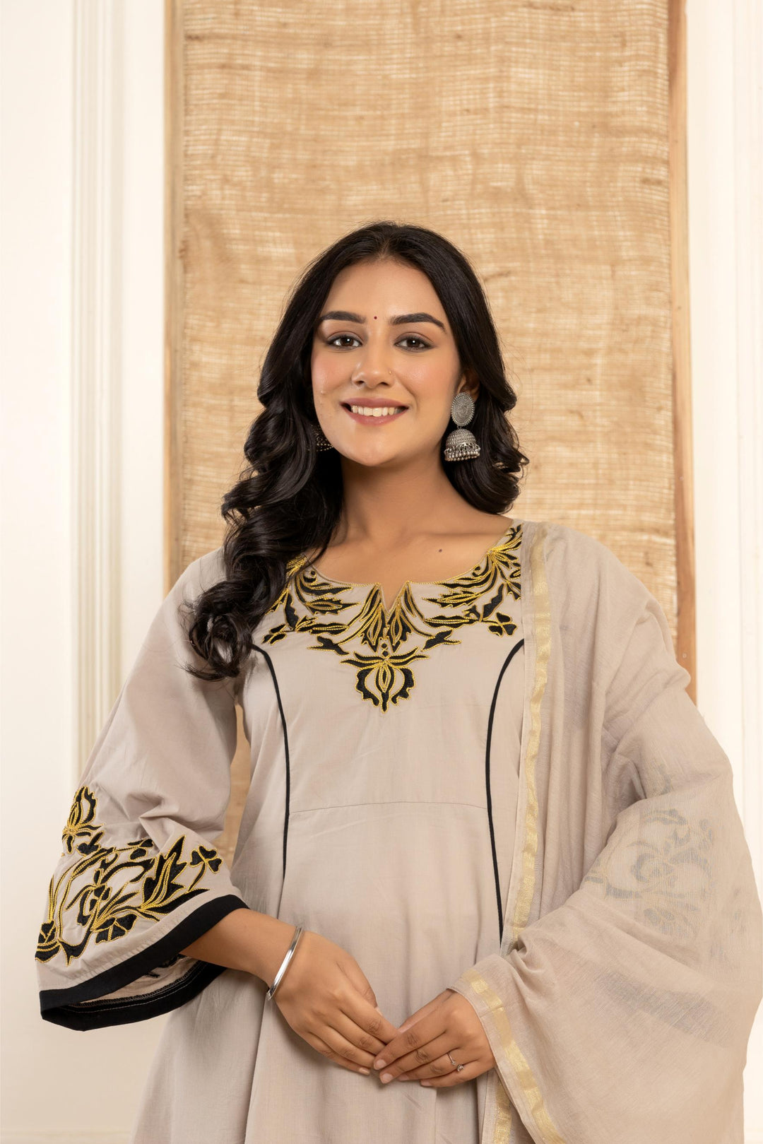 Beautiful grey kurta set with intricate embroidery, perfect for any occasion - By Ragavi