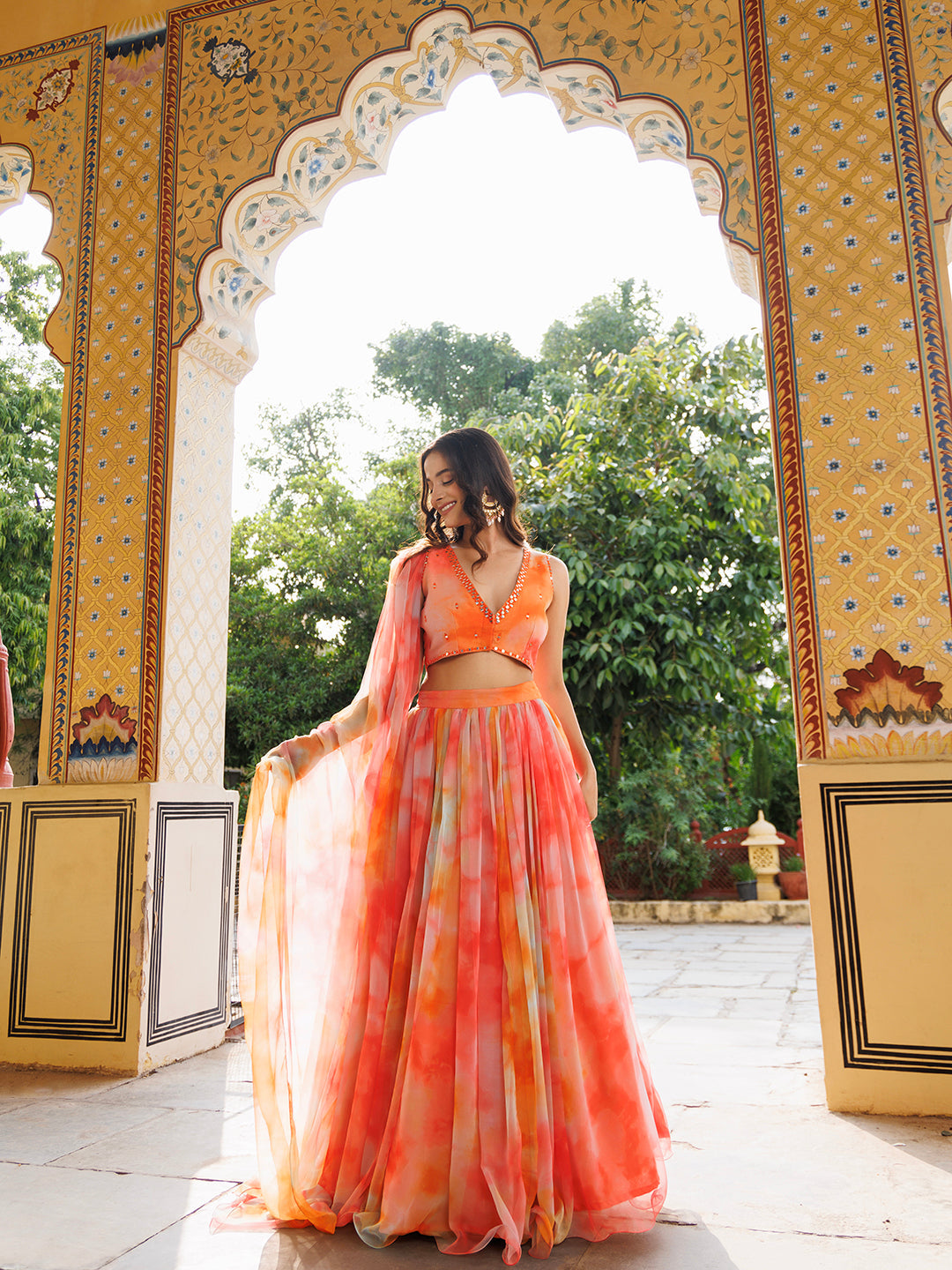 Amberglow Orange Pink Chiffon Lehenga Set with Embroidered Floral Design and Matching Dupatta - By Ragavi