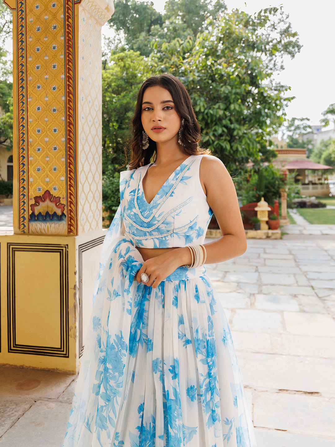 A beautiful Hawaiian white blue floral printed chiffon lehenga set by Ragavi