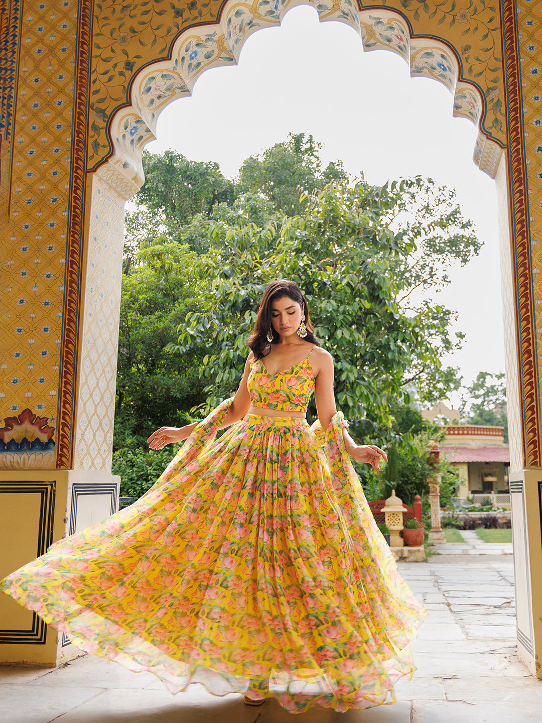 Lemon Chrome Yellow Floral Printed Chiffon Lehenga Set designed by Ragavi, featuring intricate floral patterns and a vibrant color palette perfect for any special occasion