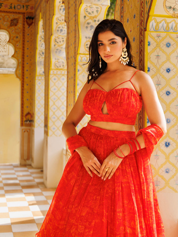 Gorgeous Ragavi Orange Floral Chiffon Lehenga Set featuring a flowing skirt and intricate floral design