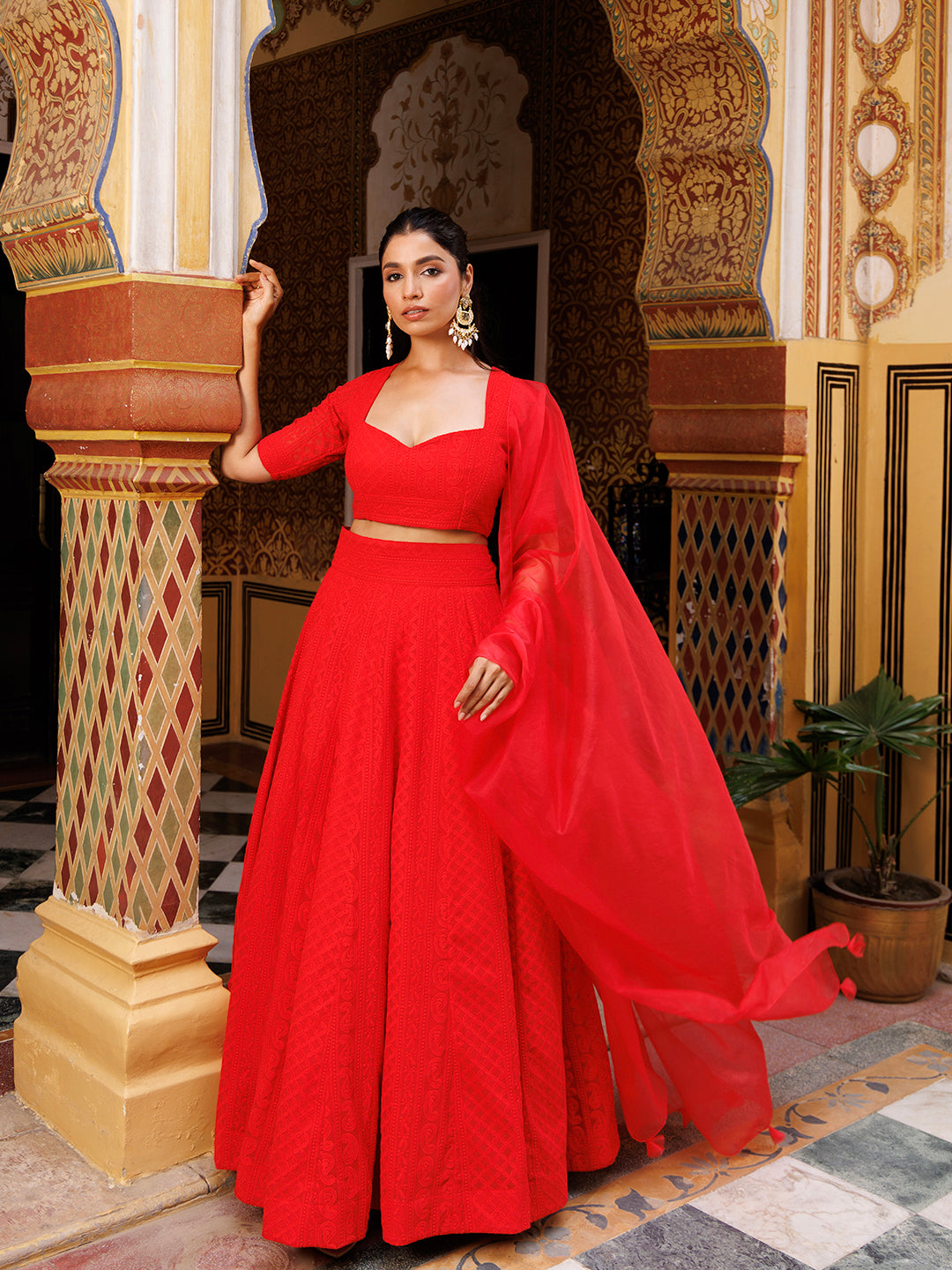 Beautiful fire red lehenga with delicate chikankari and sequin details