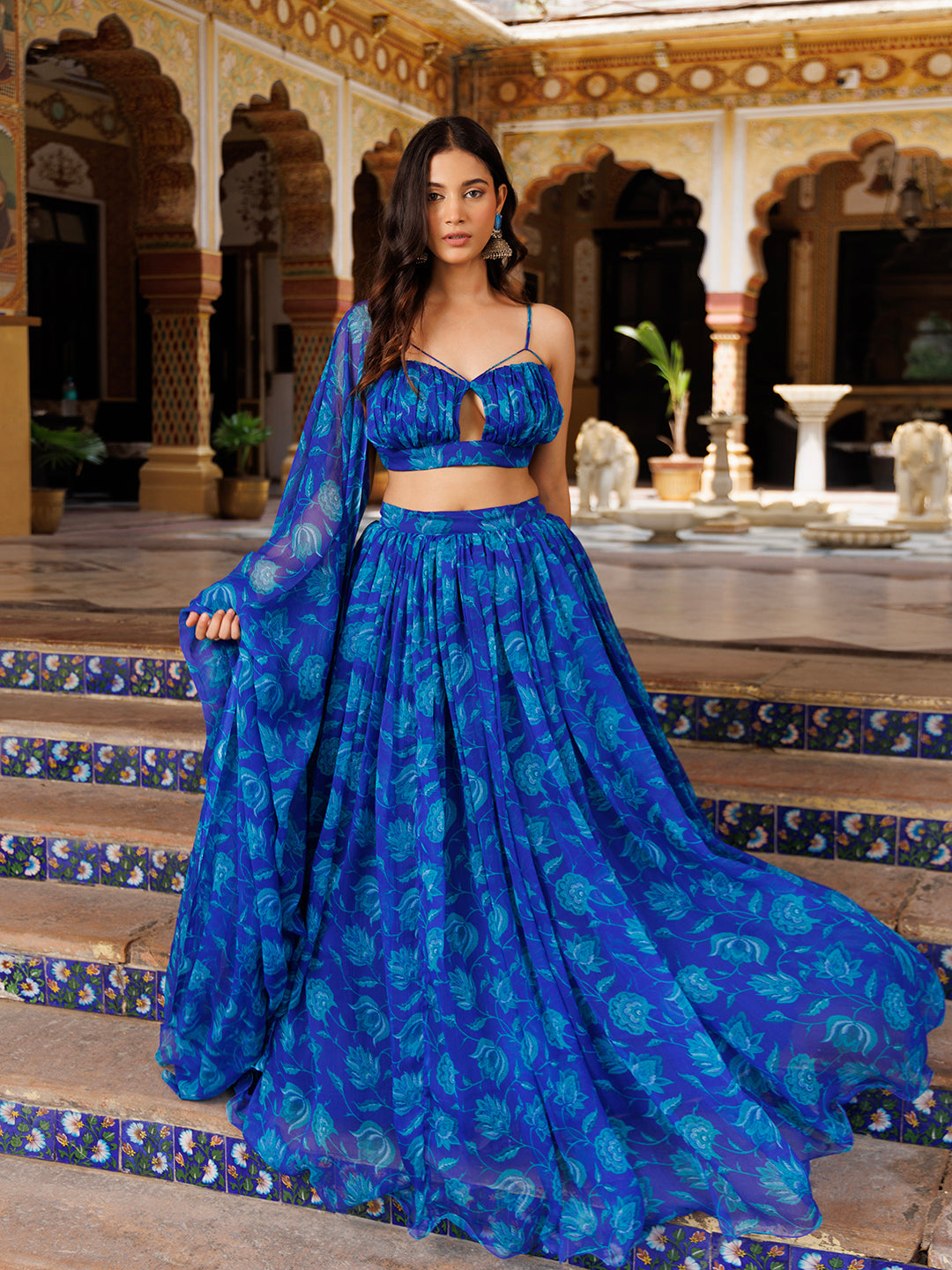 Close-up of the detailed floral print on the Lapis Blue Chiffon Lehenga Set by Ragavi