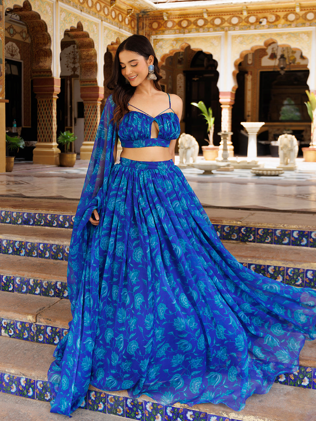 Beautiful Lapis Blue Floral Printed Chiffon Lehenga Set by Ragavi, worn by model with matching accessories