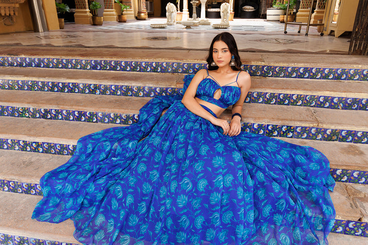 Stunning Lapis Blue Floral Printed Chiffon Lehenga Set by Ragavi, styled with traditional jewelry and elegant makeup