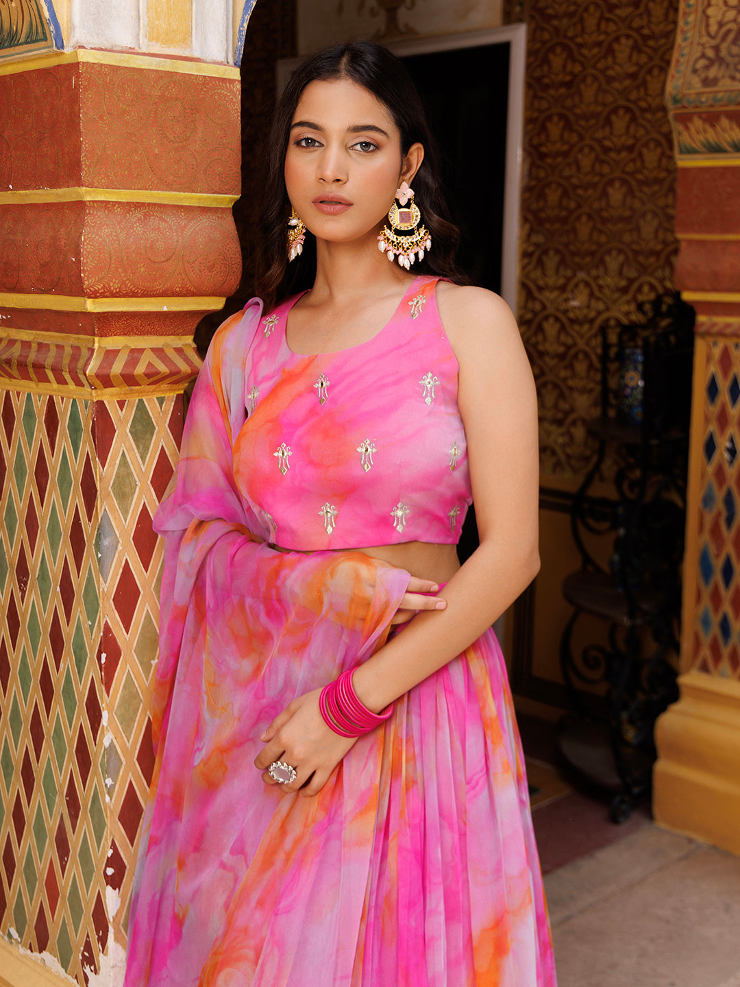 Exquisite ethnic attire in a vibrant shade of raspberry pink