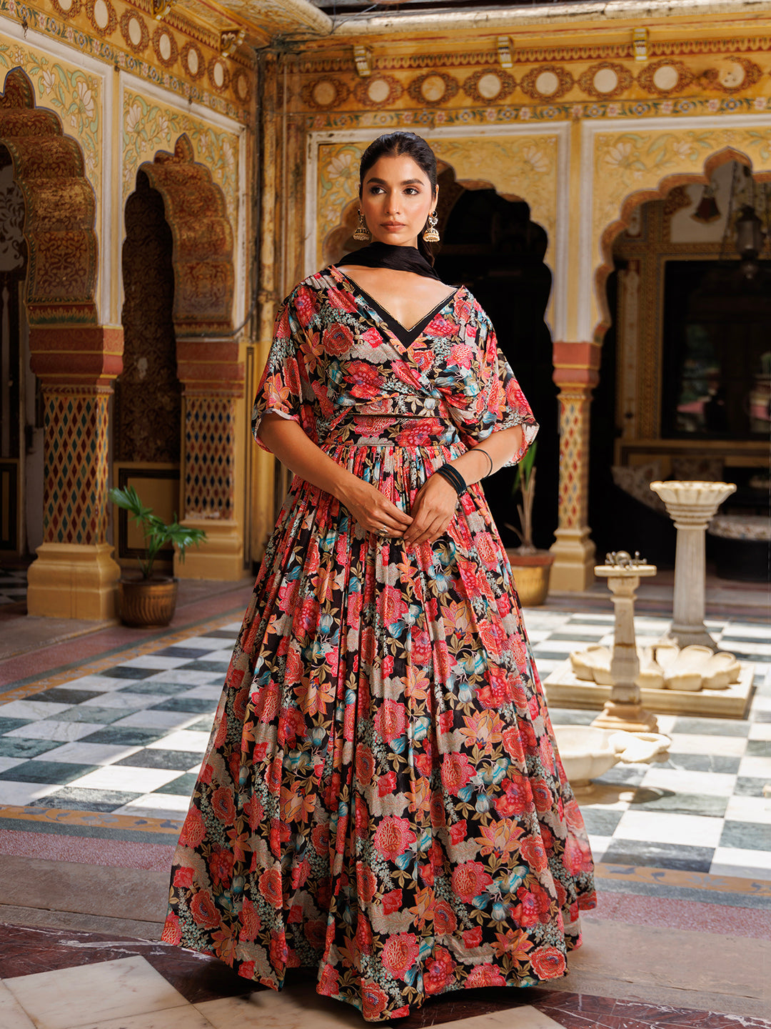 Beautiful black floral printed Chinon lehenga by Ragavi with intricate detailing and elegant design