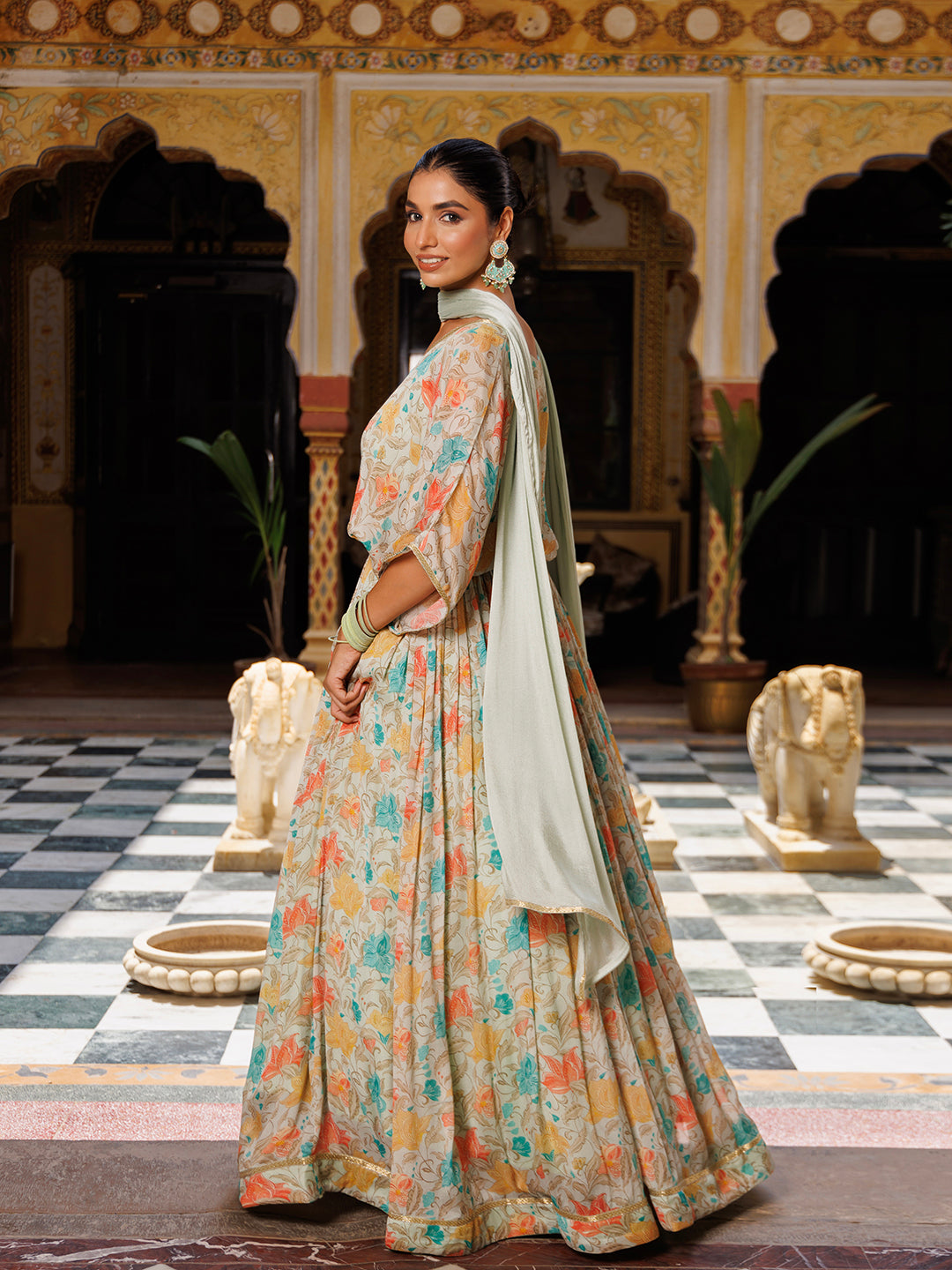 Exquisite off white lehenga featuring pure chinon fabric and floral print