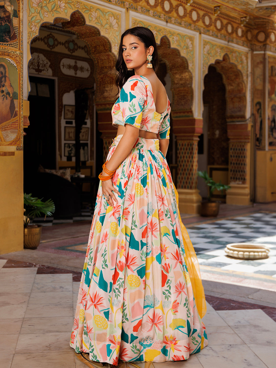 Stunning multicolor printed lehnga set by Ragavi with intricate embroidery and matching dupatta