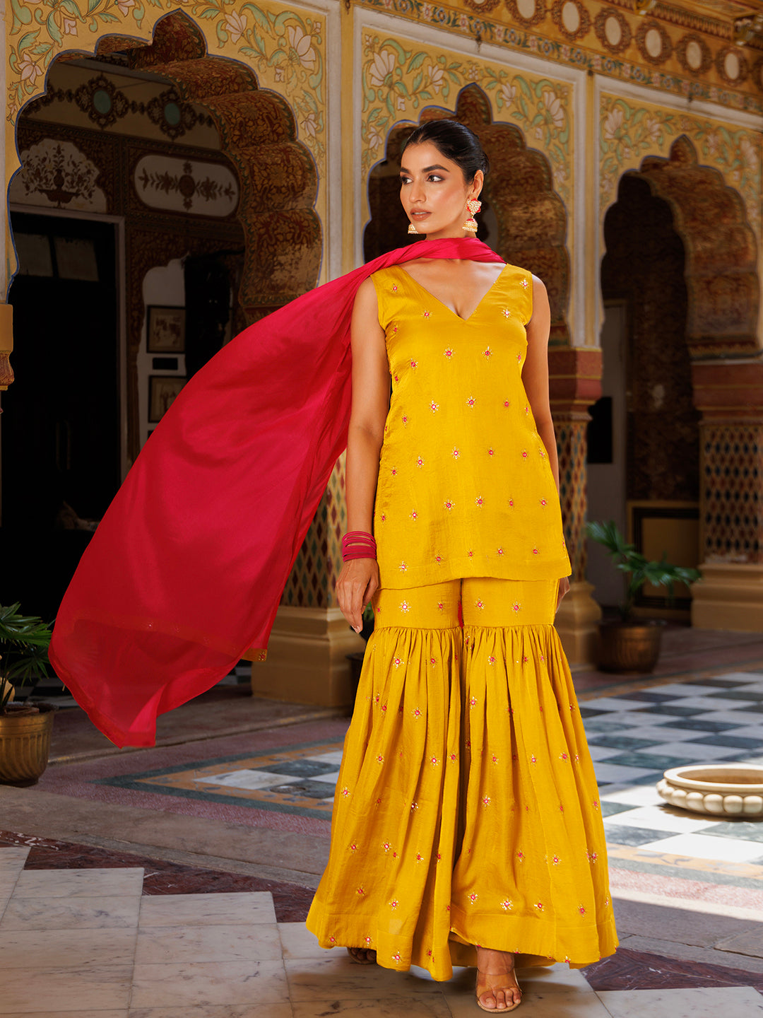  Stylish and elegant yellow and pink sharara set with intricate embroidery 