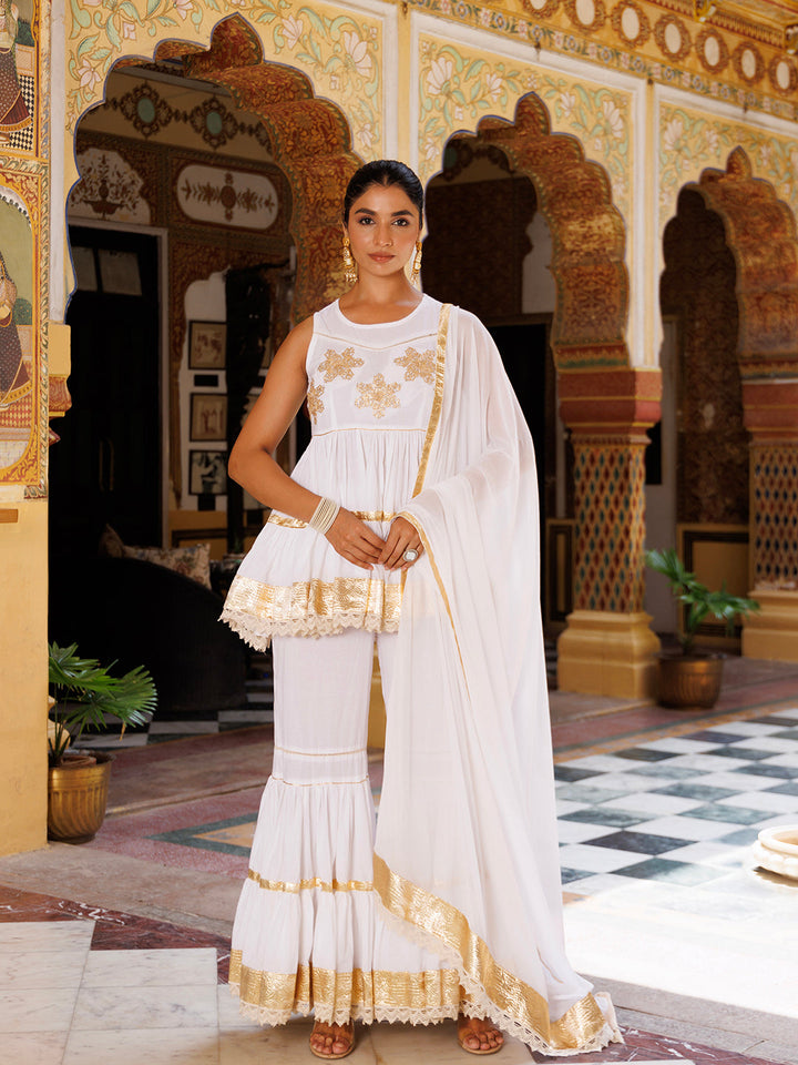 Cannoli Cream White Cotton Embroidered Sharara Set by Ragavi