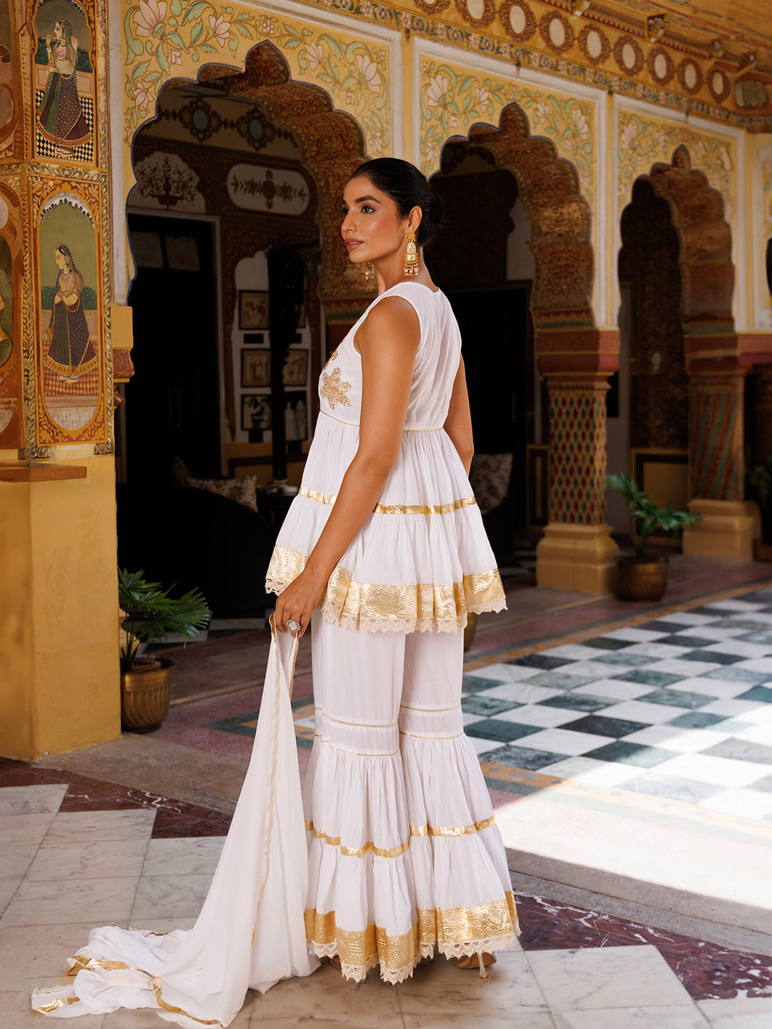 Beautifully designed Cannoli Cream White Cotton Embroidered Sharara Set