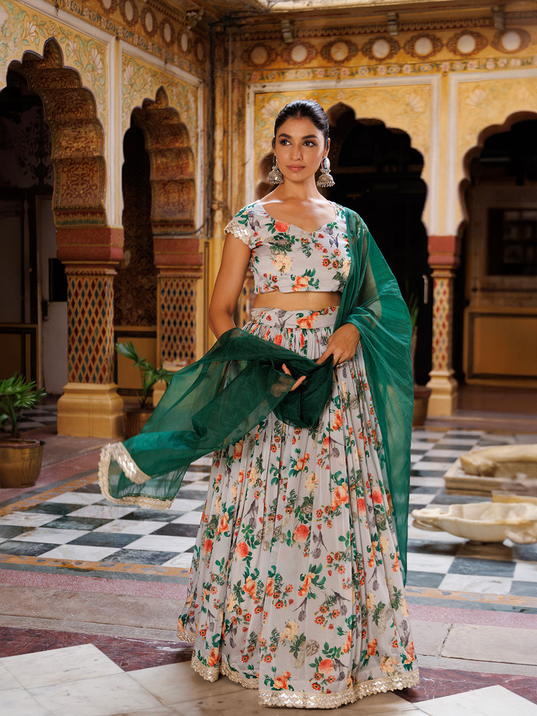 Beautiful woman wearing grey and green printed chinon lehenga by Ragavi, showcasing the flowy and luxurious fabric