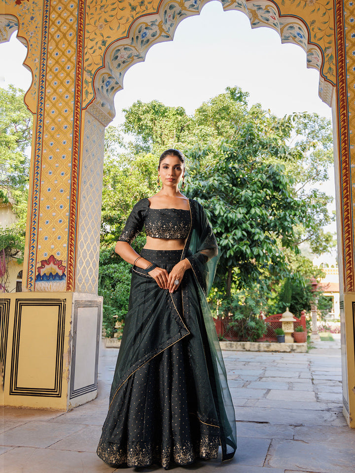 Colonial Green Gold Foil Printed Silk Lehenga Set by Ragavi showing a close-up of the intricate gold foil printing on the lehenga skirt