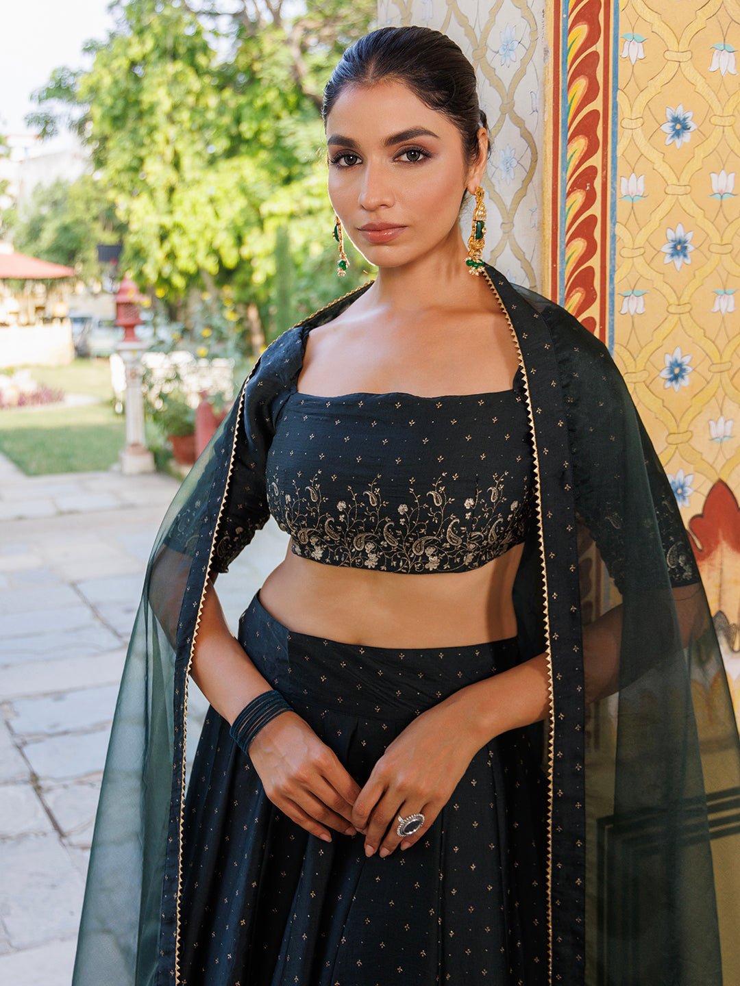  Beautiful Colonial Green Gold Foil Printed Silk Lehenga Set by Ragavi displayed from the back to show the intricate design