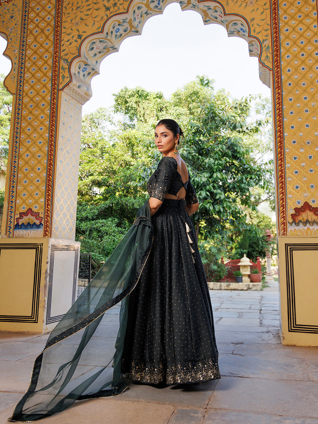  Opulent Colonial Green Gold Foil Printed Silk Lehenga Set by Ragavi with a focus on the rich green color and gold foil details