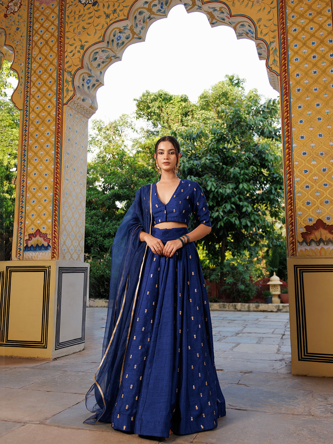  A close-up of the detailed embroidery and craftsmanship on the Galactic Blue Embroidered Silk Lehenga Set - By Ragavi, showcasing the beautiful patterns and textures of the outfit