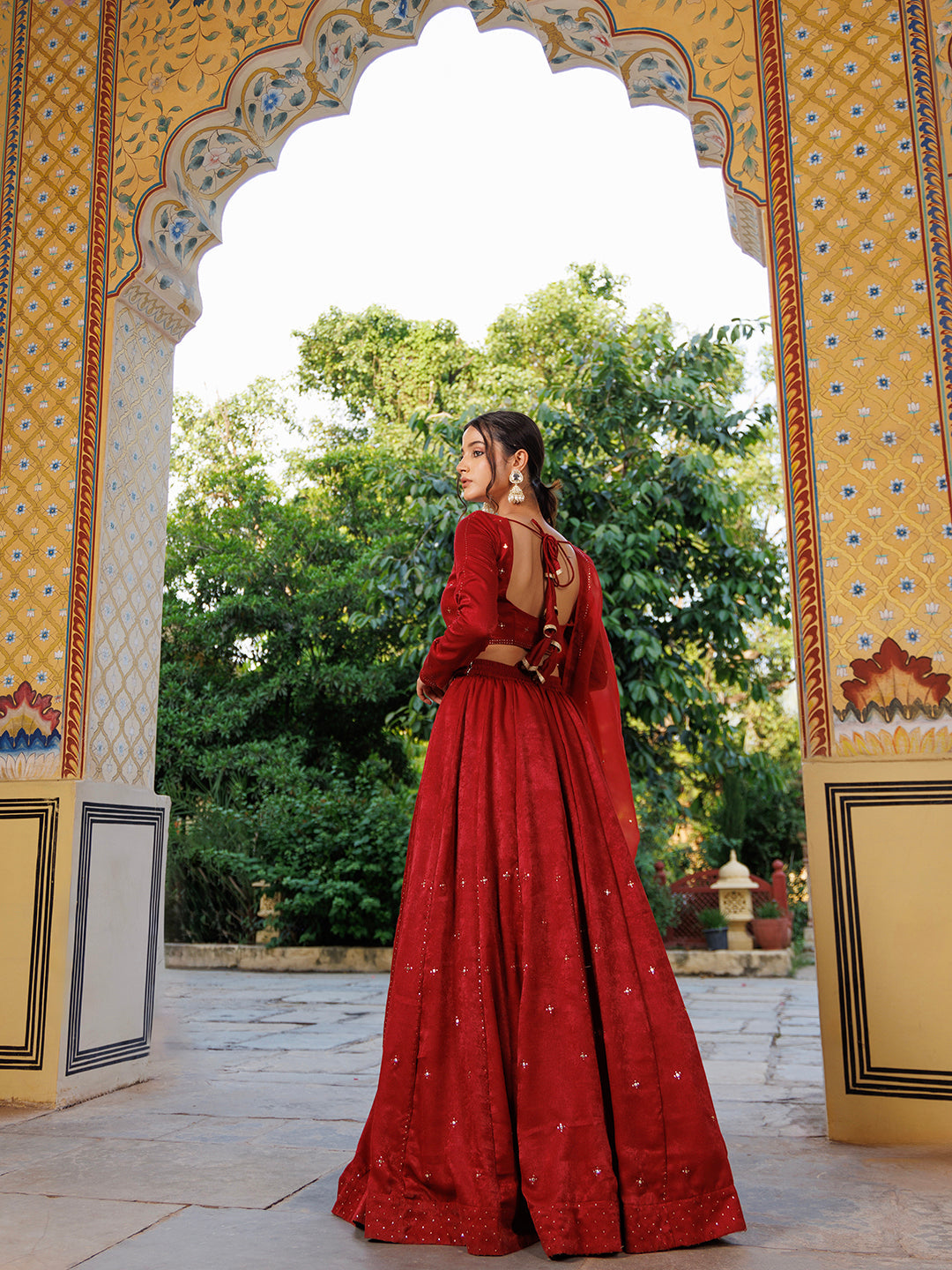 Exquisite True Red Velvet Mukaishwork Lehenga Set by Ragavi, perfect for special occasions and weddings with intricate traditional Indian embroidery and rich fabric