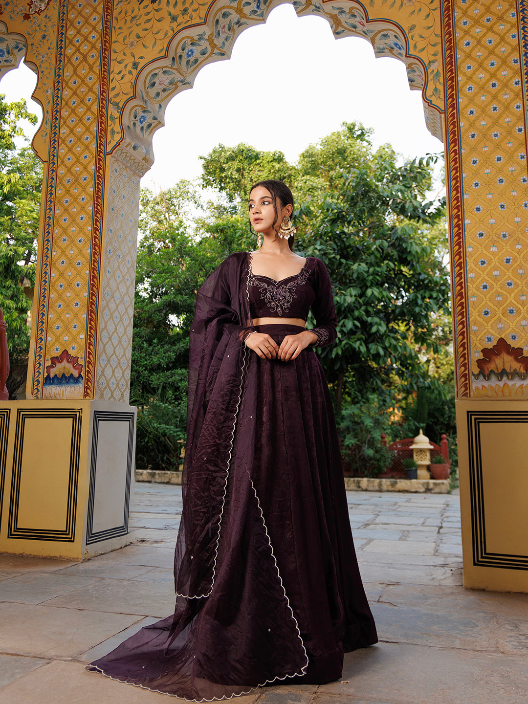 Elegant Mauve Wine Embroidered Velvet Lehenga Set by Ragavi with Gold Accents and Detailed Embroidery