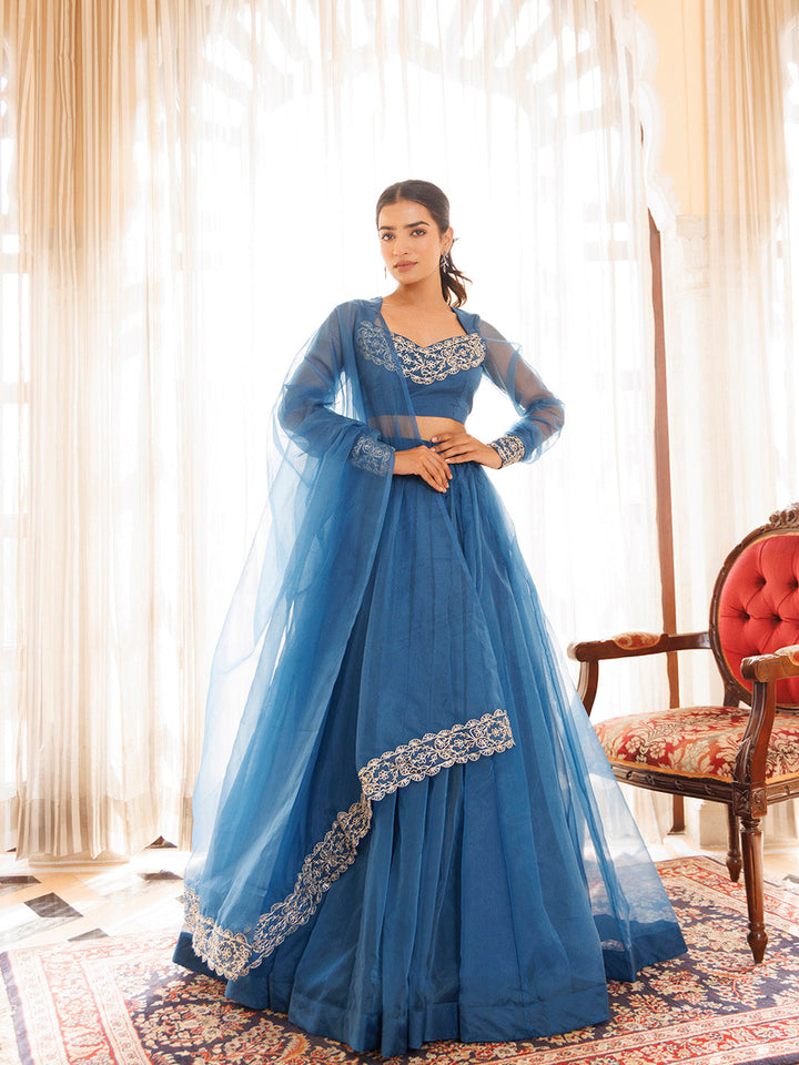 Navy blue organza lehenga set with intricate golden embroidery and matching dupatta