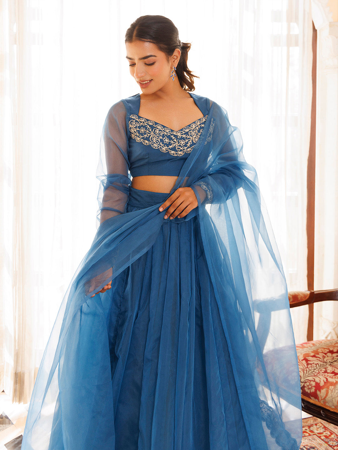 Gorgeous navy blue organza lehenga set with intricate floral embroidery and a matching dupatta