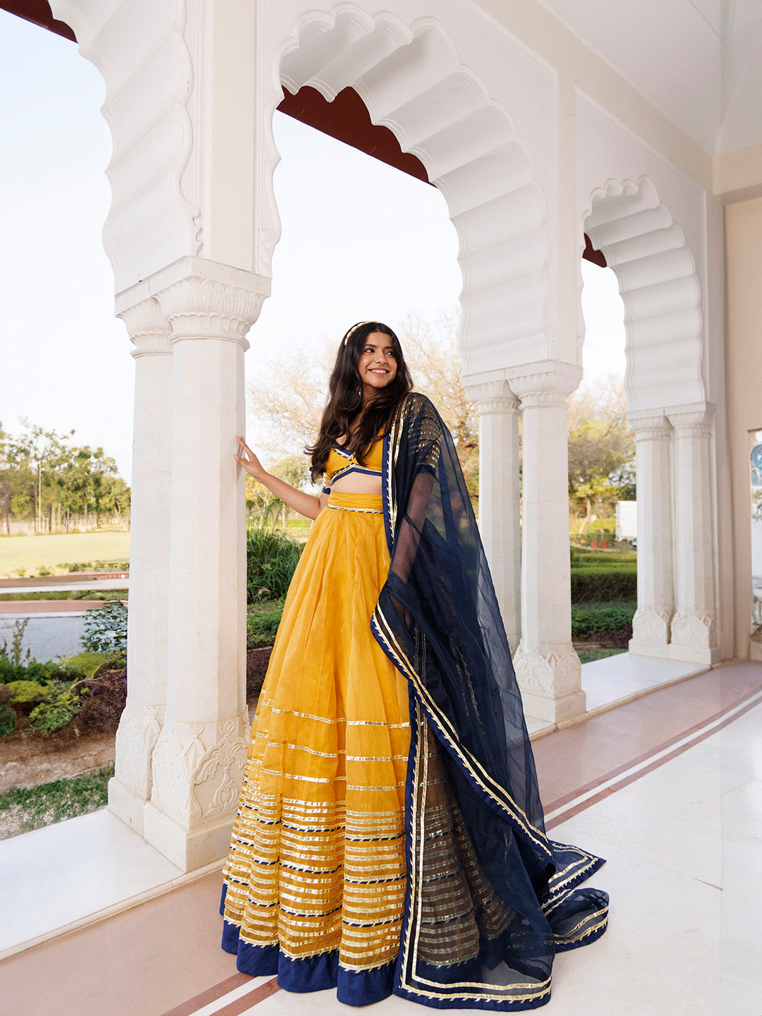 Sunset Gold Yellow and Navy Blue Lehenga Set BY RAGAVI