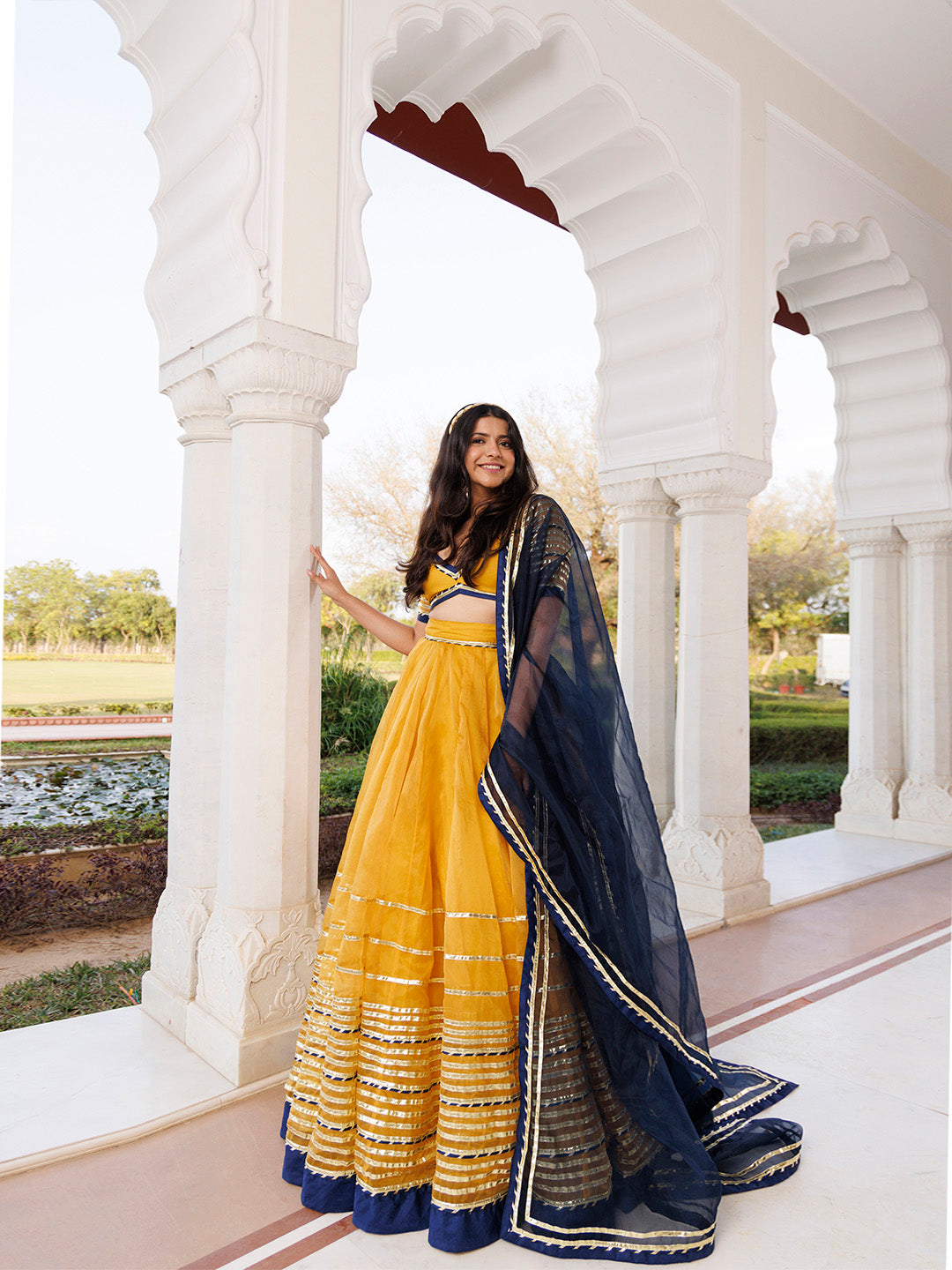 Sunset Gold Yellow and Navy Blue Lehenga Set BY RAGAVI