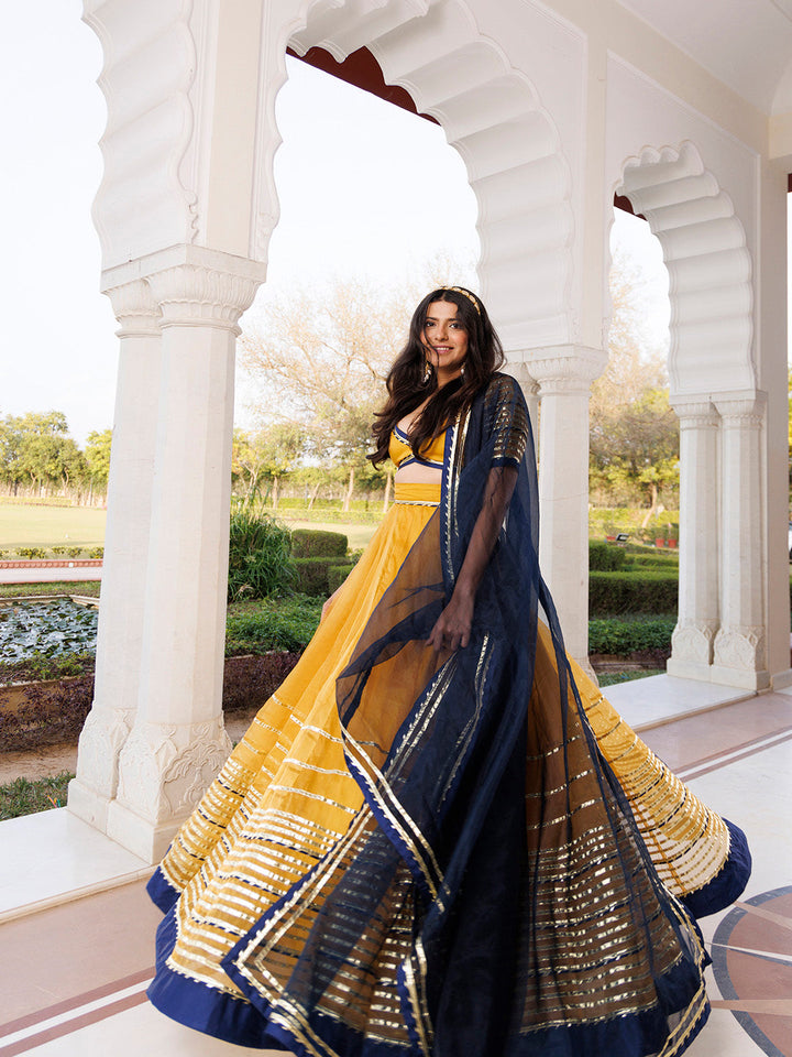 Sunset Gold Yellow and Navy Blue Lehenga Set BY RAGAVI